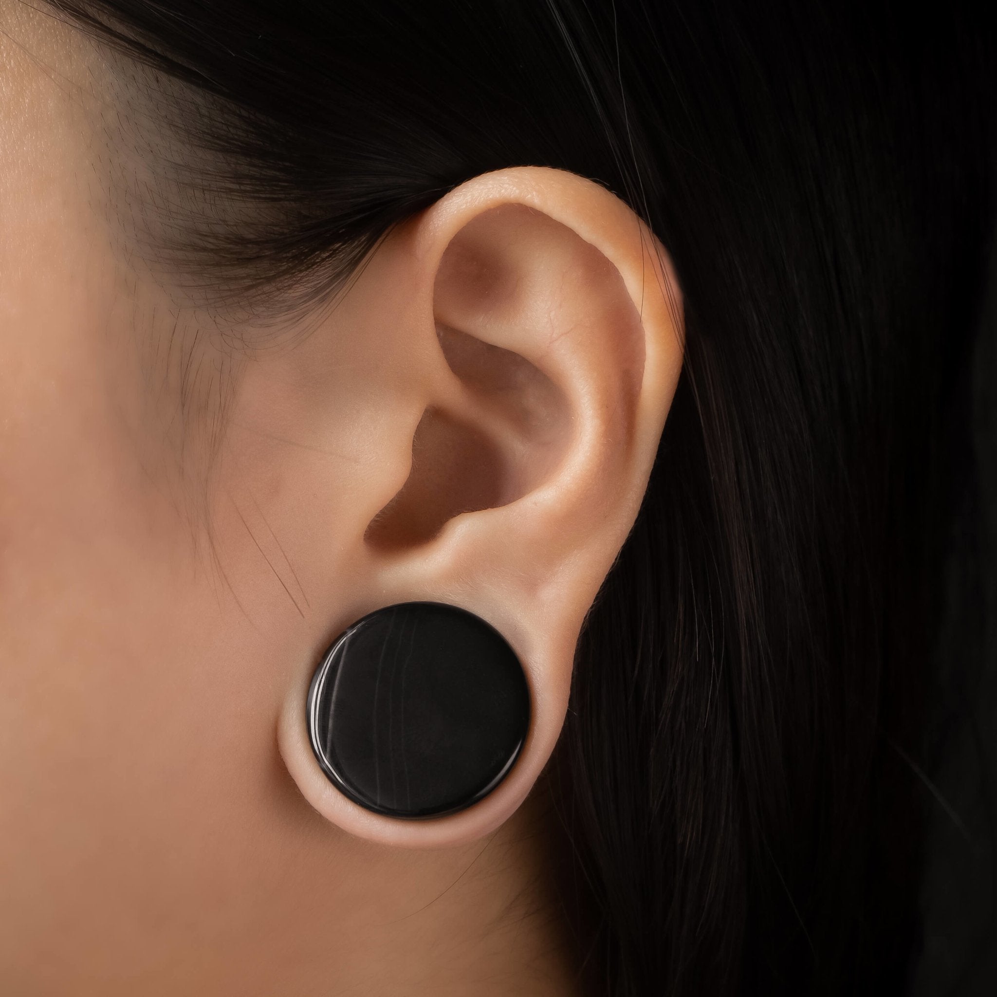 Black ear plug piercing shop